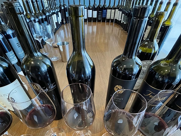 Series of wine glasses and bottles as part of a wine tasting